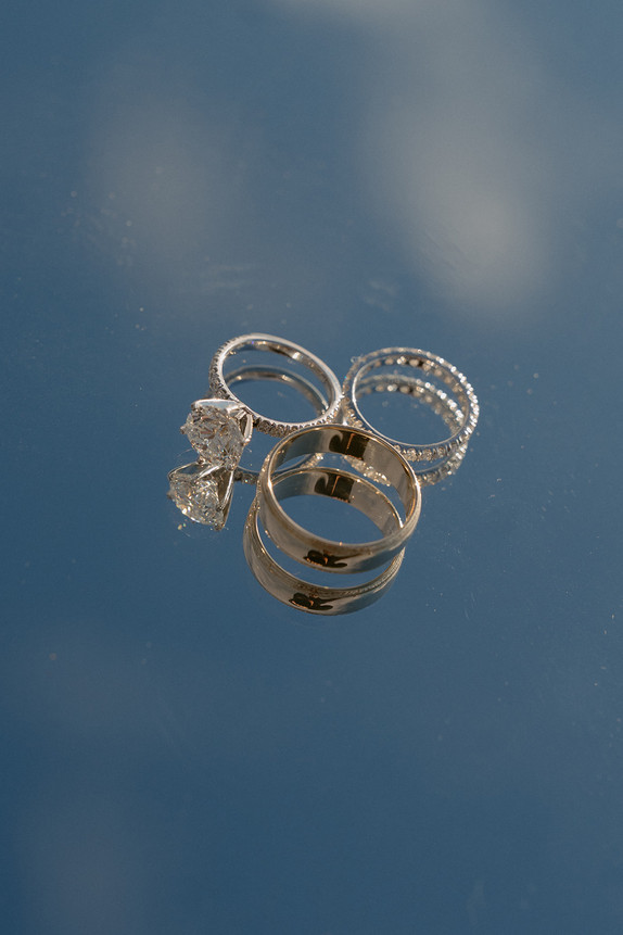 Couple on mountain top in franconia notch on elopement day enjoying sunrise.