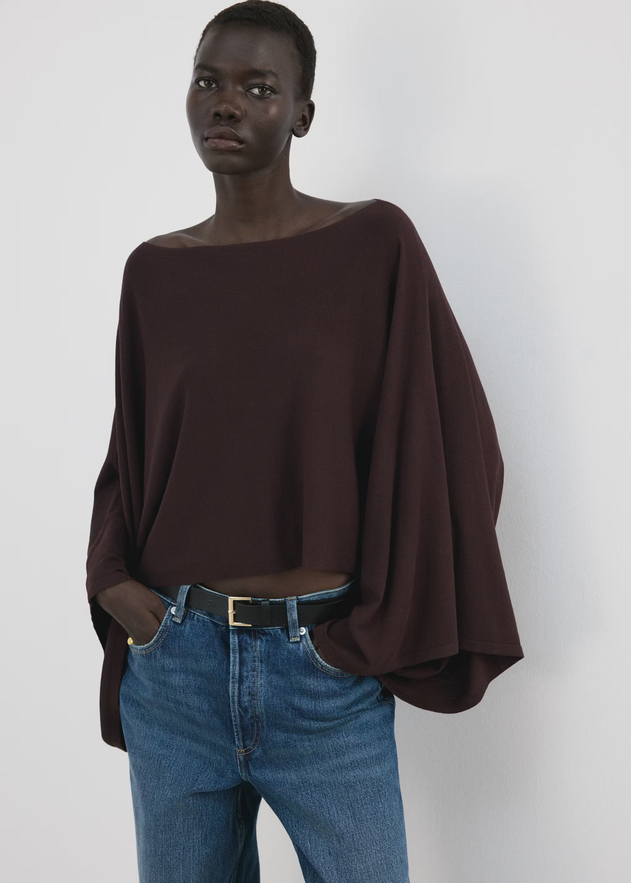 Asymmetrical knitted cape