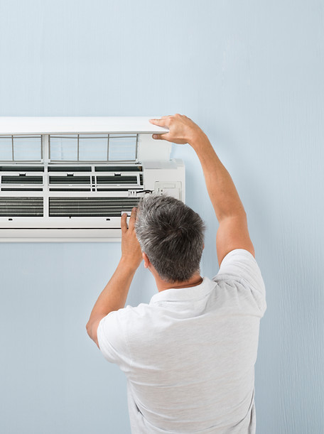 Worker Cleaning the Filters