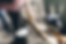 Lady Justice statue holding scales. Background is blurred, creating a focus on the metallic scales and figure. Soft ambient lighting.