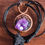 Thumbnail: Raw Amethyst sculpted pendant wrapped in macrame
