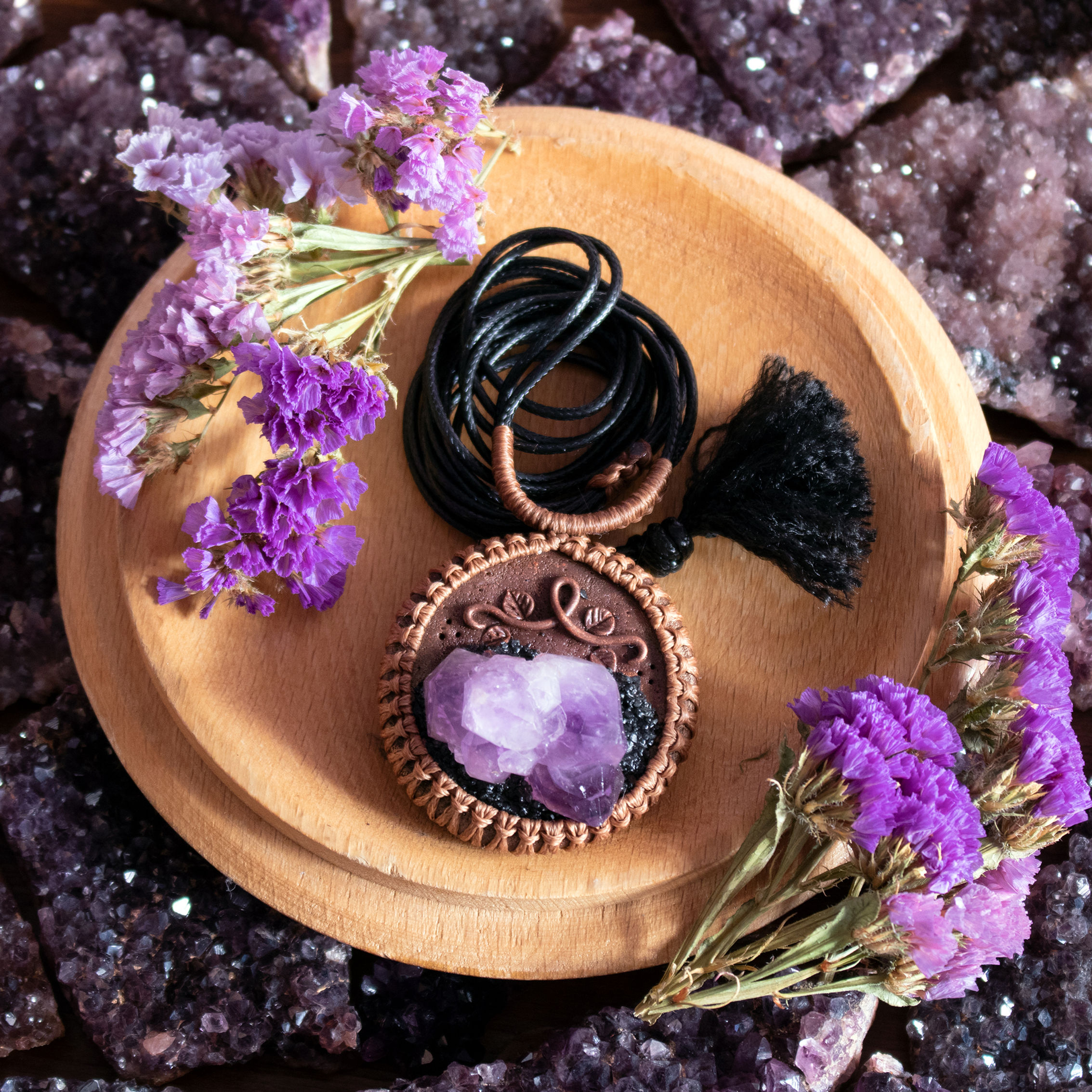 Raw Amethyst sculpted pendant wrapped in macrame