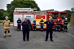 Firefighters standing at attention for an award cermony