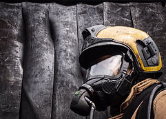 Close up photo of a firefighter wearing a helmet and an oxygen mask