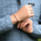 Thumbnail: red string bracelet