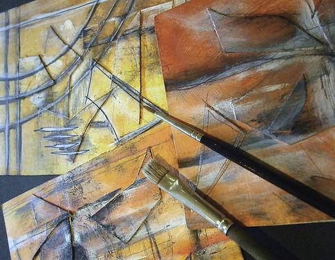 Paintings and Brushes Over an Abstract Design