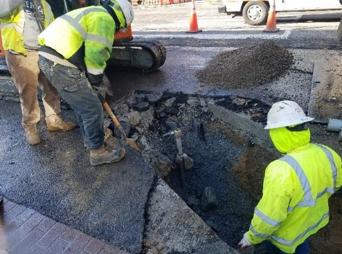 Omni exposing water main at SEC of 14th & R St