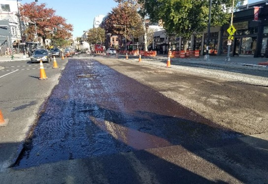 Tack coat placed at 14th St northbound left lane near Swann St
