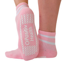 Pink quarter grip socks with white stripes and O Positiv Health branding, designed for a female-focused marketing campaign