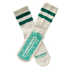 Example of white and green socks with fully customizable grip design for studio branding