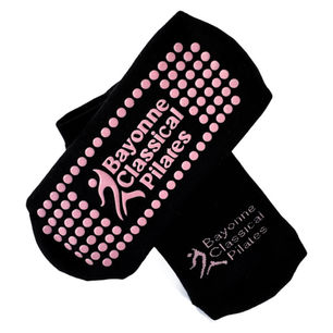 Bayonne Classical Pilates custom-branded black and pink grip socks