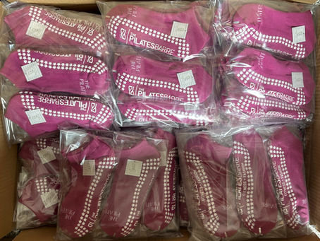 Pink ankle style grip socks for the pilates barre fitness studio