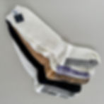Neutral color custom grip socks stacked together showing retail-ready collection for Pilates and fitness studios