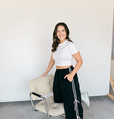 big smile, knee on chair.JPG