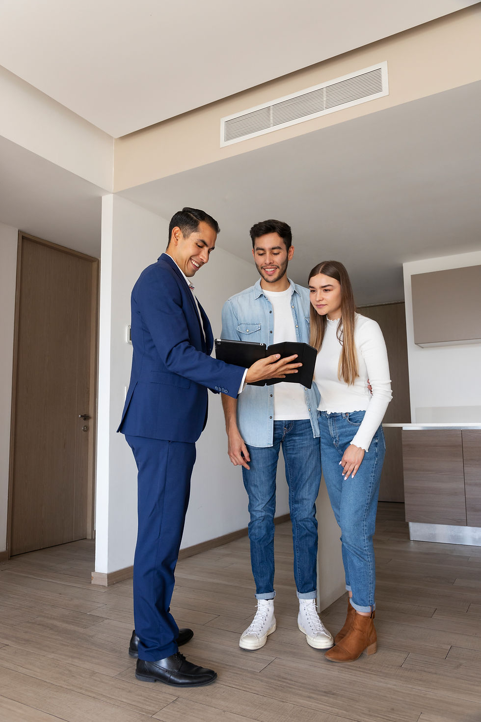 full-shot-couple-talking-real-estate-agent.jpg