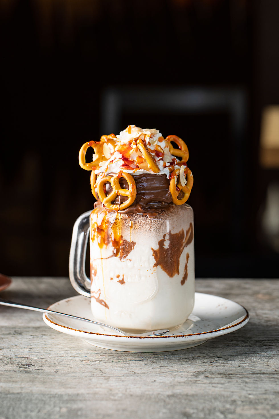 creamy-vanilla-milky-shake-with-pretzels-white-saucer.jpg