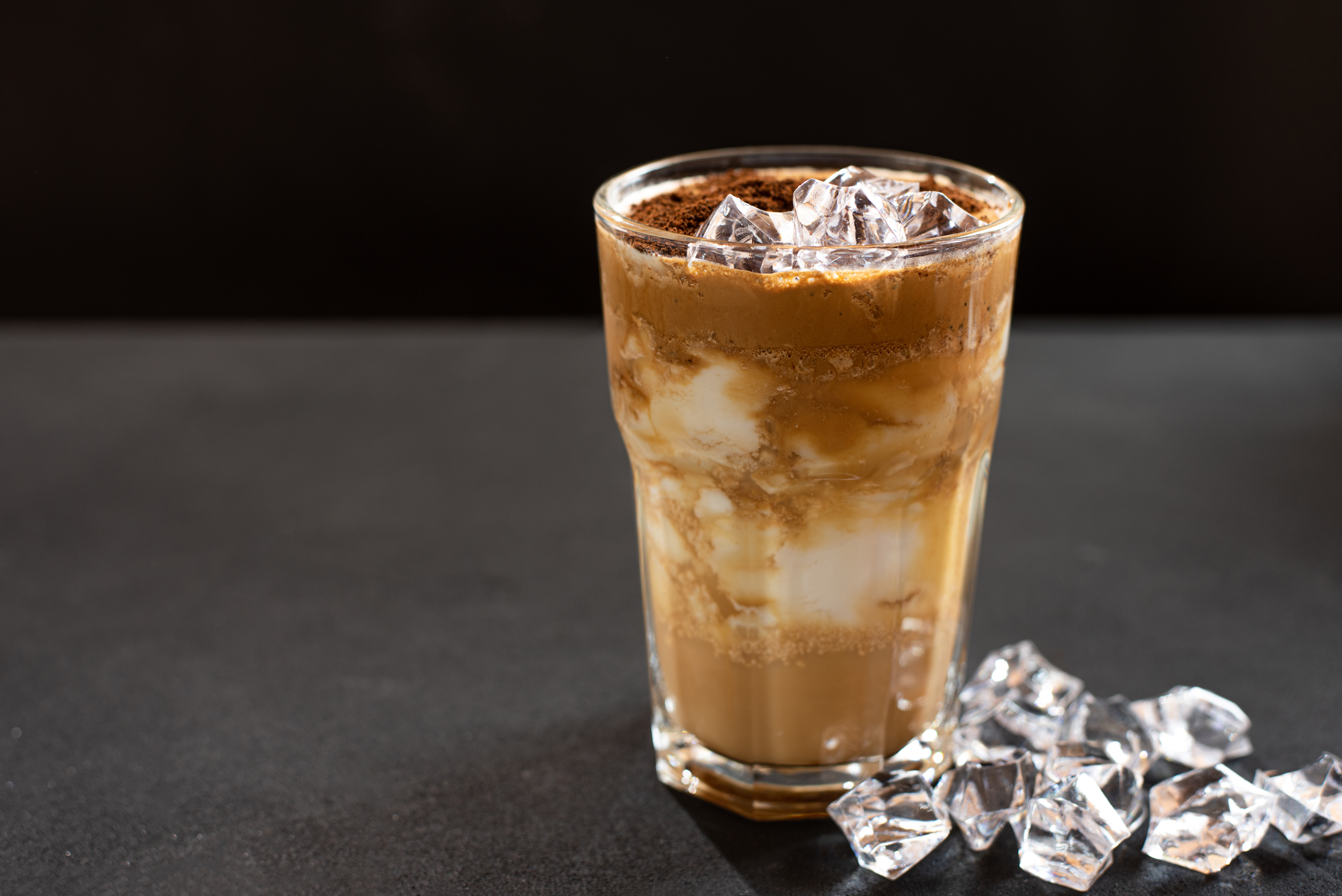 dalgona-coffee-with-ice-dark-background-horizontal-view-copy-space.jpg