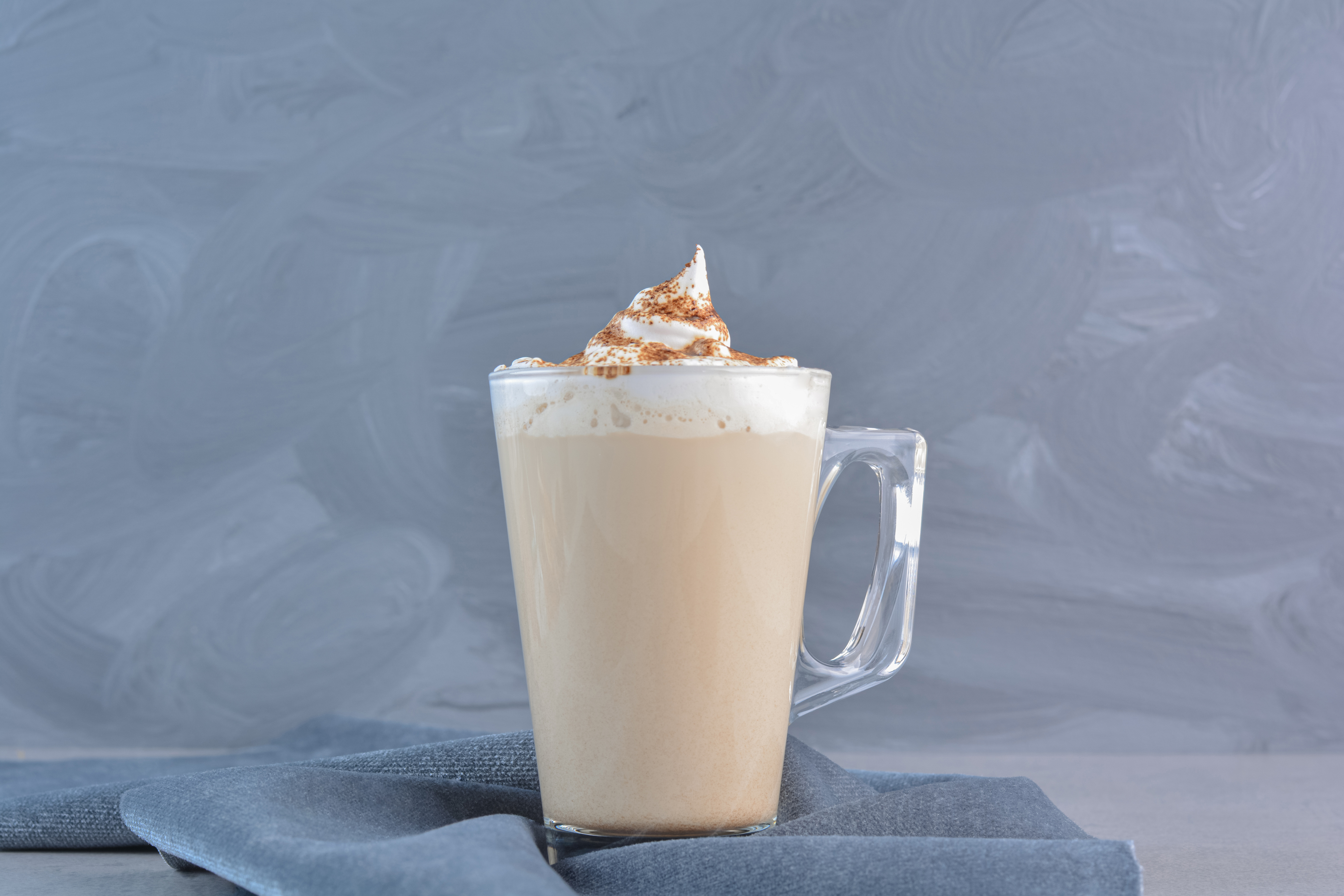 cup-hot-delicious-coffee-decorated-with-cacao-blue-cloth.jpg