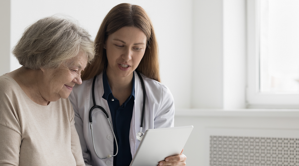 Doctor showing tablet to senior patient