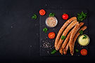 grilled-sausages-dark-background-oktoberfest-flat-lay-top-view.jpg