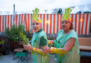 Two people dressed up as celery sticks