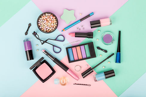 set of professional decorative cosmetics, makeup tools and accessory on multicolored backg