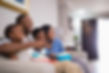 family watching TV in hotel