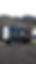 Close up crop of a branded removals van parked in a rural location