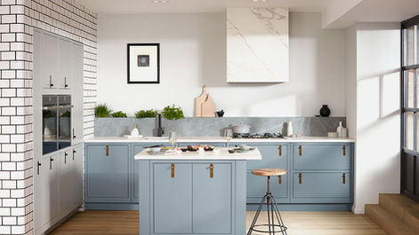 Light blue slab kitchen units featuring a matching central island and copper handles.