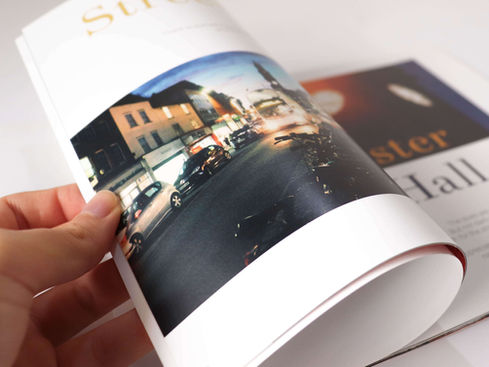 Pages of an editorial being flipped.