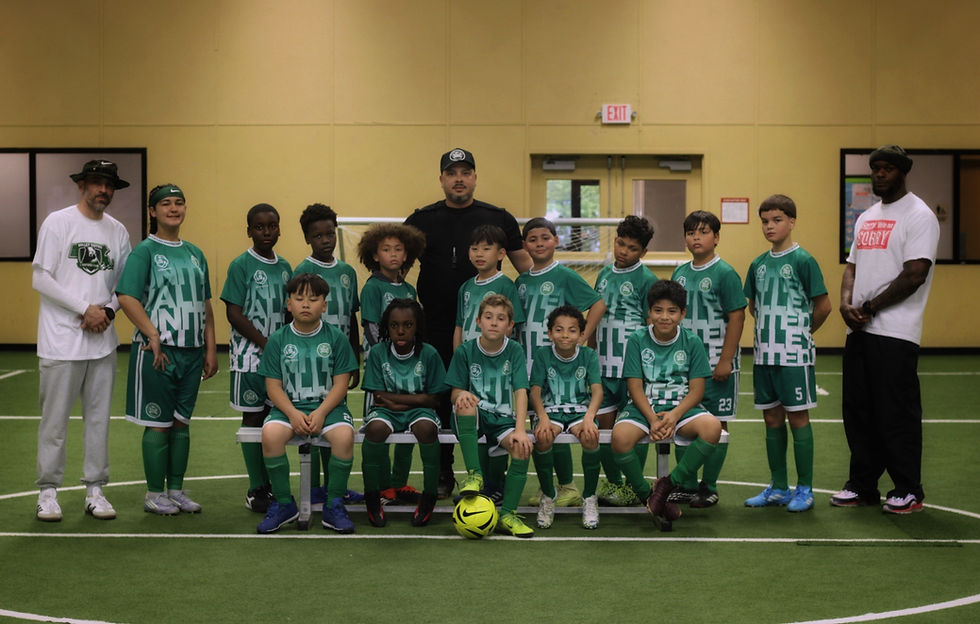 Eye-level view of a diverse group of children playing soccer together