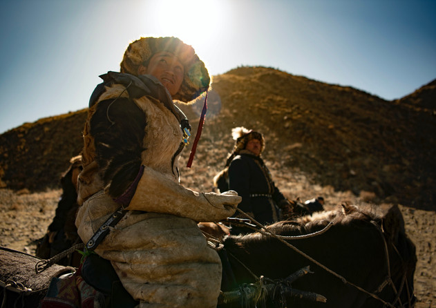 An eagle hunter looks towards the sky where eagles are released to capture the prey as part of the Golden Eagle Festival in Ölgii.
- Western Mongolia.