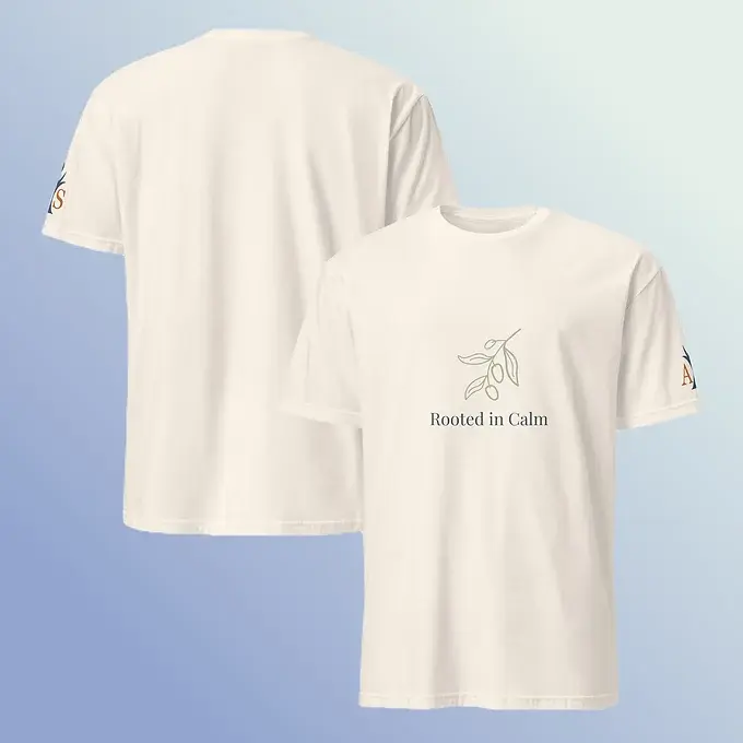 Front and back view of the Rooted in Calm T-Shirt by Aroma Sculpt, shown on a soft cream background.