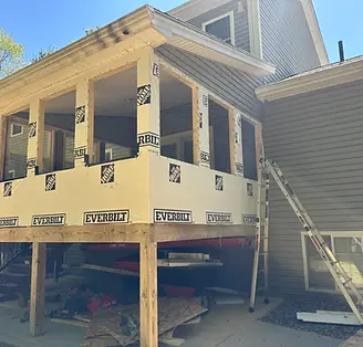 Renovation of a deck addition, with framing and joist tape.