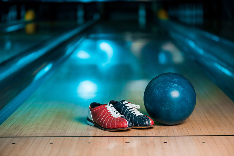 selective-focus-of-bowling-shoes-and-ball-on-skitt-2023-02-15-06-02-06-utc.jpg