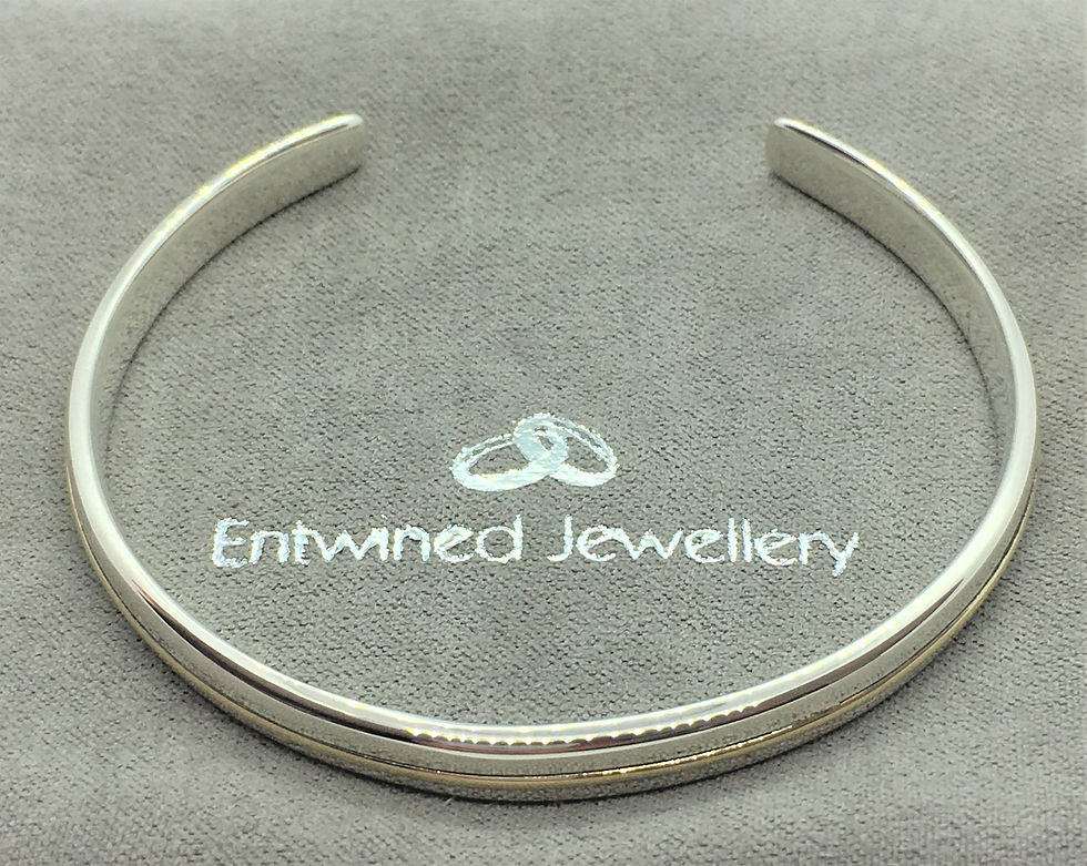 Thumbnail: 9ct Gold - 925 Sterling Silver Classic Silver Cuff Bracelet on the Entwined Jewellery soft Pouch view.