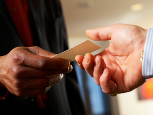 Hands exchanging business cards