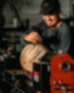 Artisan hand-finishing wood piece in workshop – custom woodworking process at C-los Studio in Dobbs Ferry, NY
