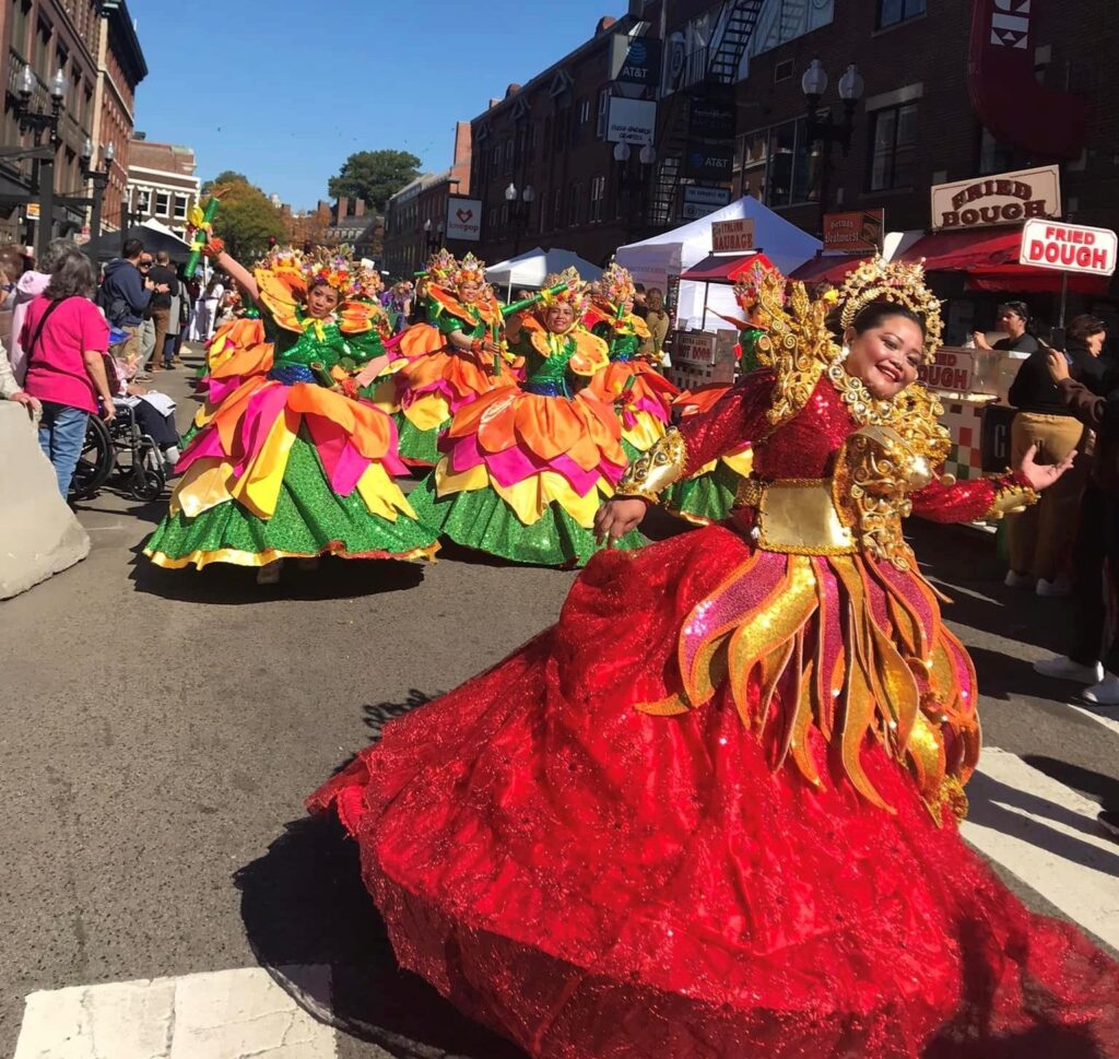 Dancers from Cebu, Inc. dazzle passersby with their Sinulog dance and colorful costumes. (Photo by Cathy Uy)