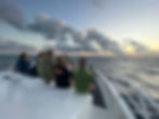 divers enjoying sunset on the Great Barrier Reef