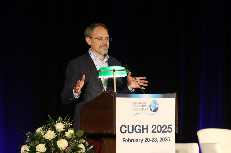 Dr. Brandon Kohrt delivers a speech at CUGH 2025 in Atlanta, Georgia.