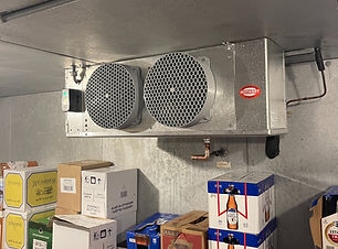 Refrigeration unit inside a walk-in cooler