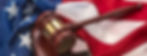 American flag draped around a judge's gavel block and the United States Constitution for u