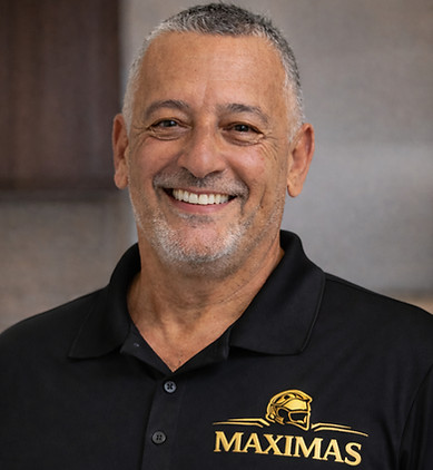 Confident smile with _MAXIMAS_ branding_edited.jpg