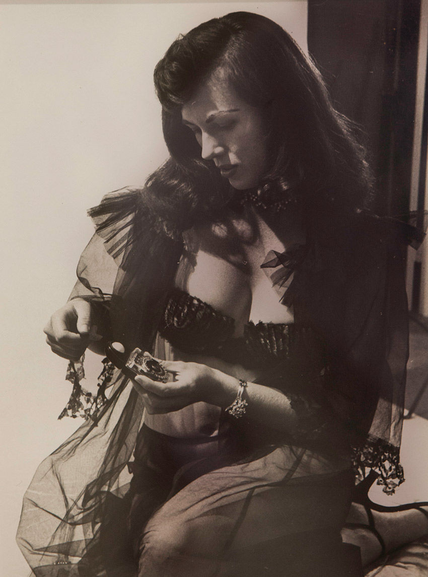 Bunny Yeager, “Bunny in Black Lace with Exposure Meter,” 1955, Silver gelatin print
