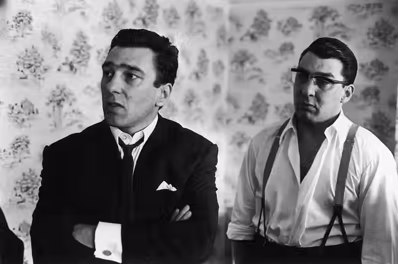 Two smart men looking mean