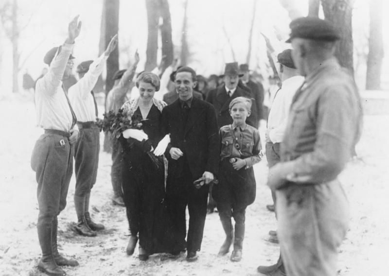 10-year-old Harald Quandt (right) at his mother's marriage to Goebbels in 1931 (with Hitler in the background)