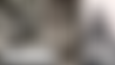 Three black-and-white photos: man on a motorcycle, shirtless man with a drink, and man sitting with a camera. Casual, relaxed mood.