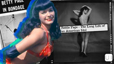 Smiling woman in red swimsuit, black gloves. Vintage black-and-white background with bondage theme. Text: "Bettie Page - The Long Life of an American Idol."