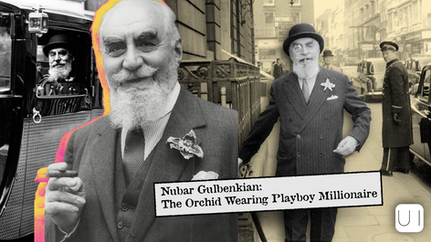 Bearded man in suit with an orchid, smiling. He stands on a busy street with vintage cars. Text reads: "Nubar Gulbenkian: The Orchid Wearing Playboy Millionaire."